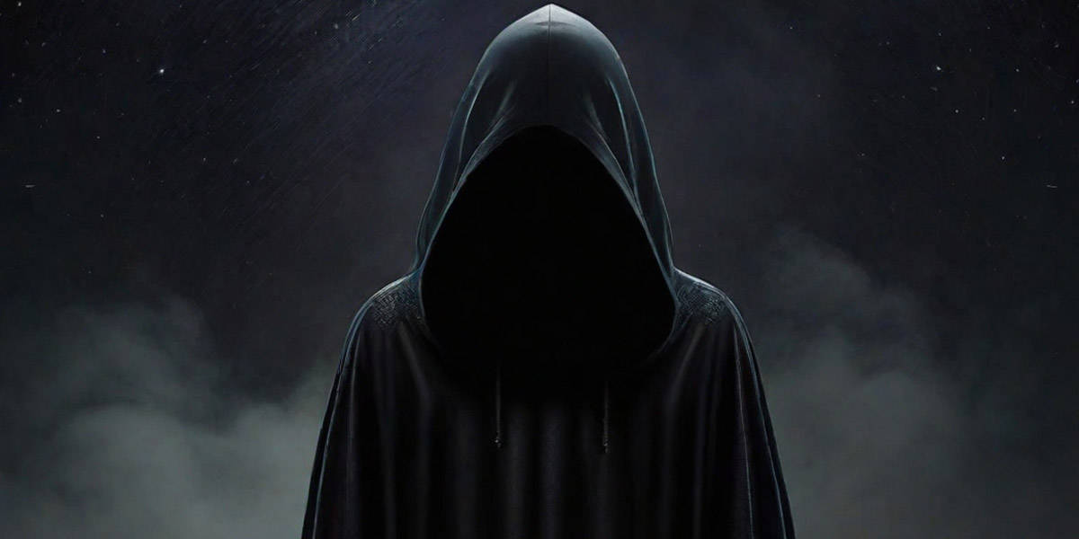 Black Hooded Figure with No Face Standing Silent