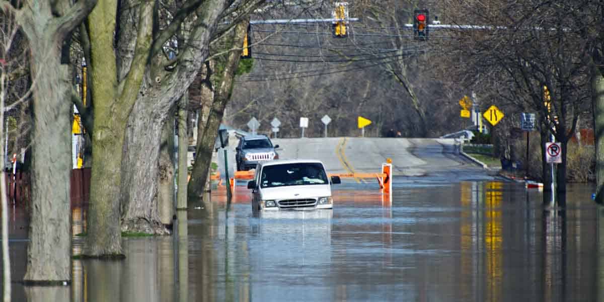 Water flooding car in a flooded urban area